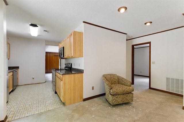 kitchen featuring ornamental molding and appliances with stainless steel finishes