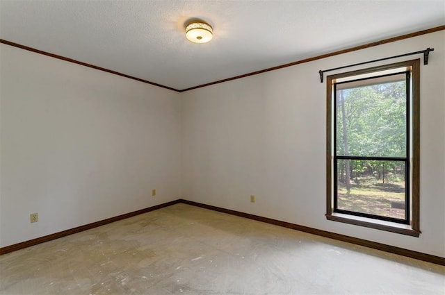 unfurnished room featuring crown molding