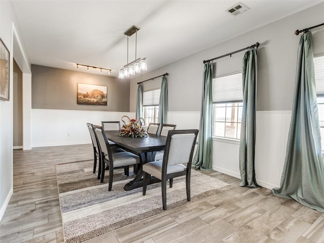 dining area with track lighting