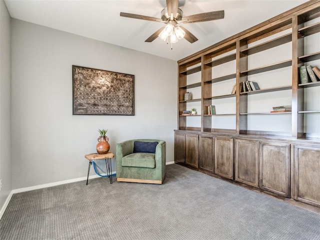 unfurnished room with ceiling fan and light carpet