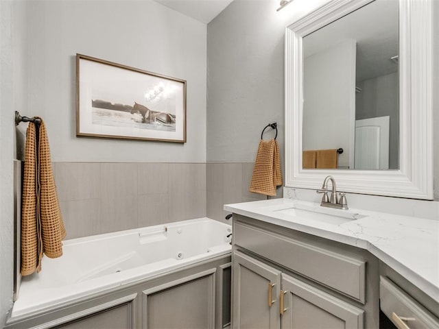 bathroom featuring a tub and vanity