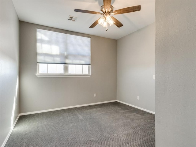 carpeted empty room featuring ceiling fan