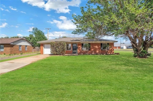 ranch-style home with a garage and a front lawn