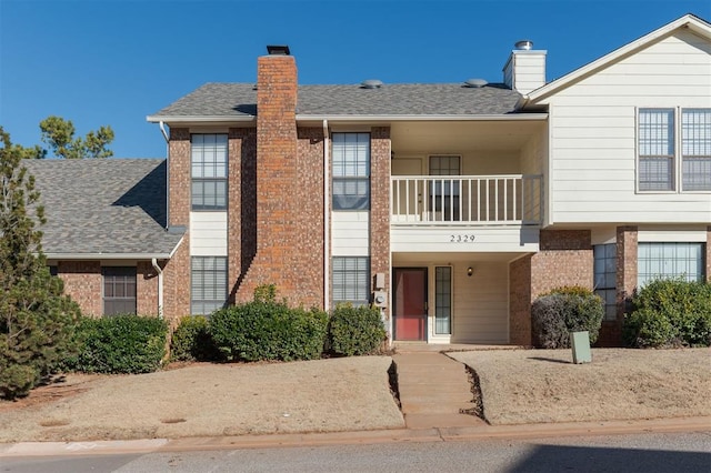 view of front of property with a balcony