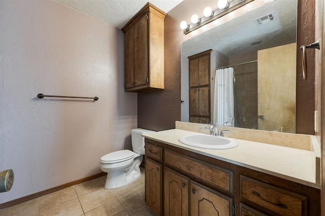 bathroom featuring toilet, a textured ceiling, tile patterned floors, a shower with shower curtain, and vanity