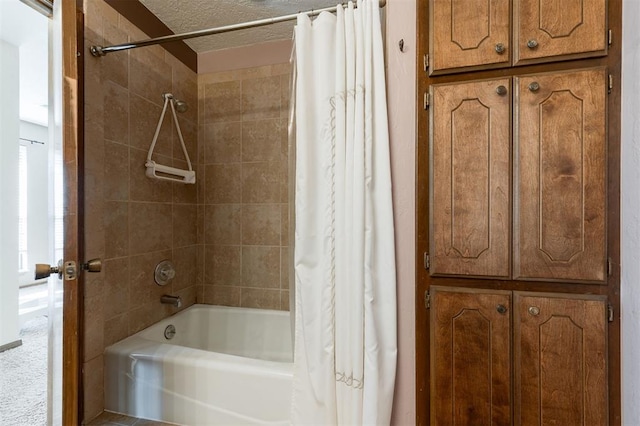 bathroom featuring a textured ceiling and shower / bath combination with curtain