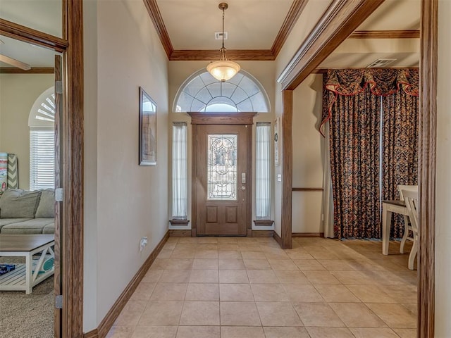 tiled entrance foyer with crown molding