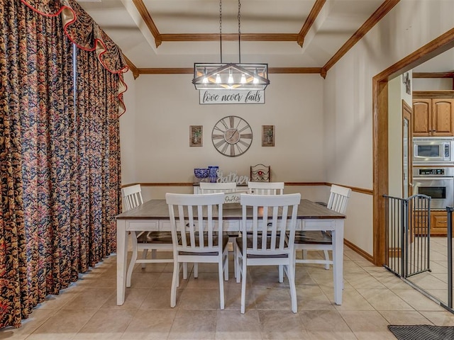 dining space featuring crown molding, light tile patterned floors, and a tray ceiling