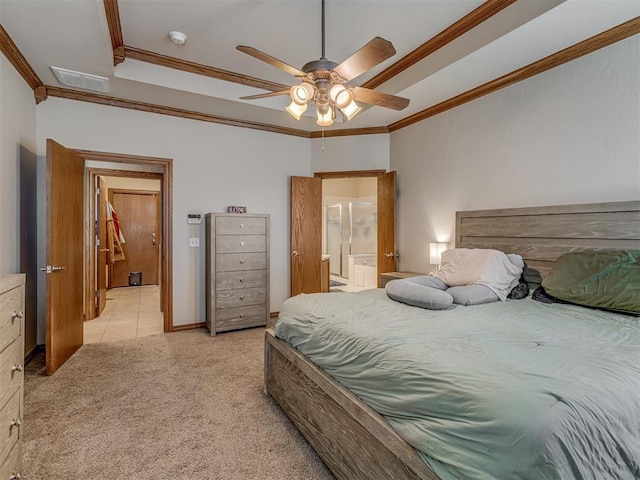 bedroom featuring crown molding, light colored carpet, ceiling fan, and ensuite bath