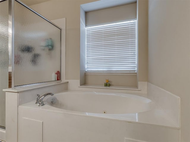 bathroom with separate shower and tub