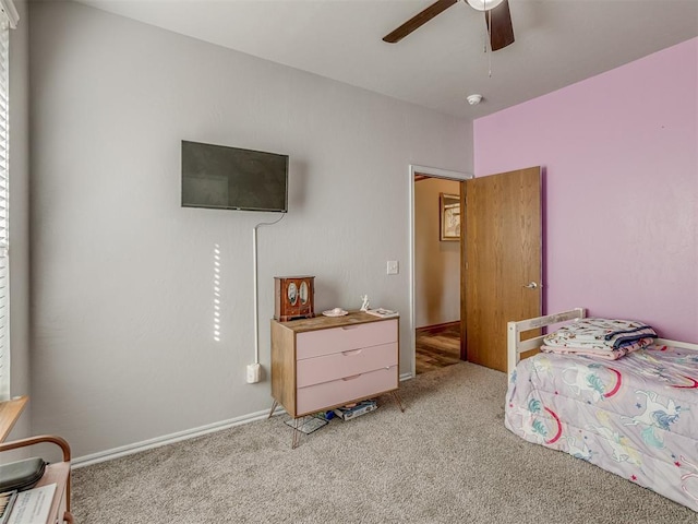 bedroom with light colored carpet and ceiling fan