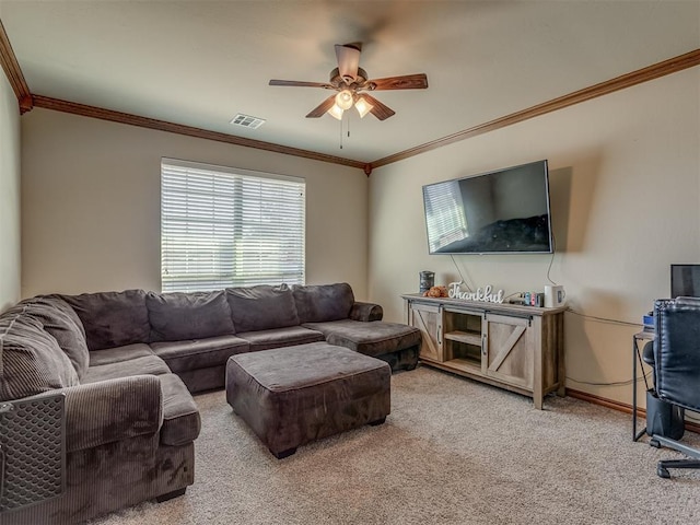 living room with ceiling fan, light colored carpet, and ornamental molding