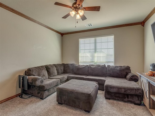 carpeted living room with crown molding and ceiling fan