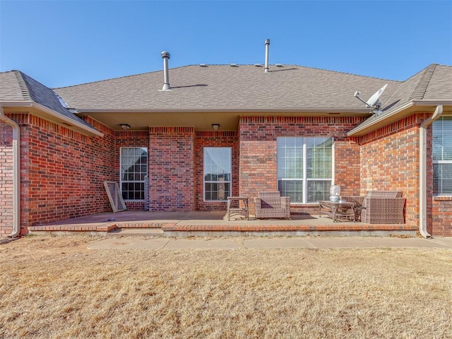 rear view of house featuring a patio