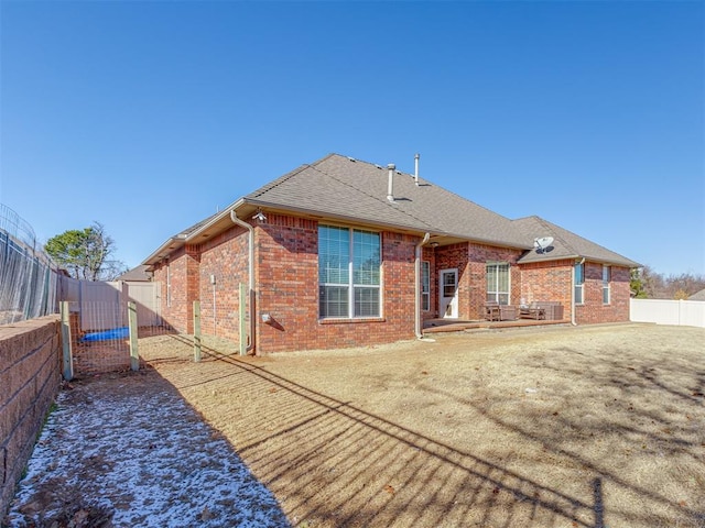 back of property with a patio