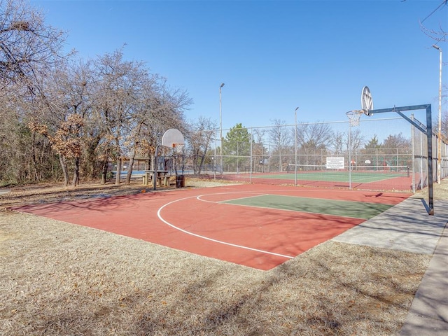 view of basketball court with tennis court