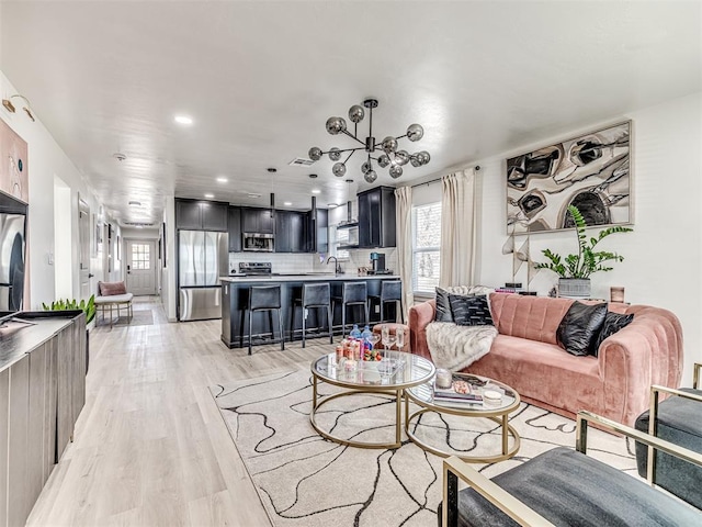 living room with light hardwood / wood-style flooring