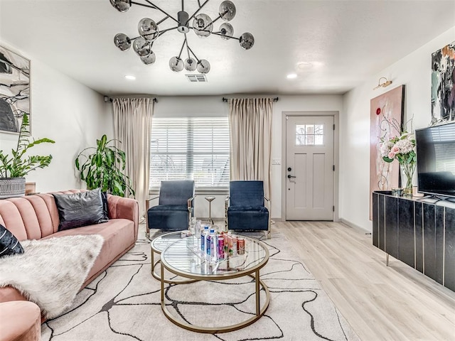 living room with light hardwood / wood-style flooring