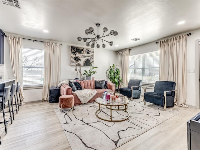 living room featuring light hardwood / wood-style flooring and a wealth of natural light