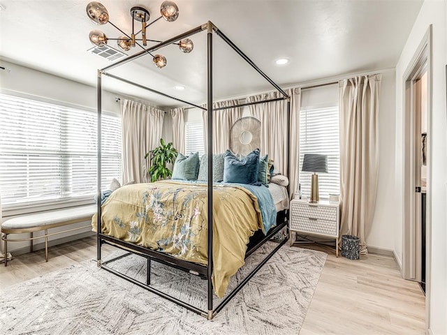 bedroom with hardwood / wood-style floors