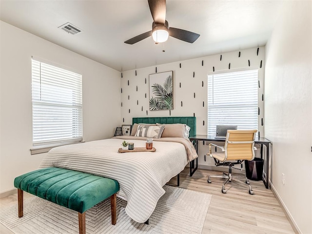 bedroom featuring ceiling fan and light wood-type flooring