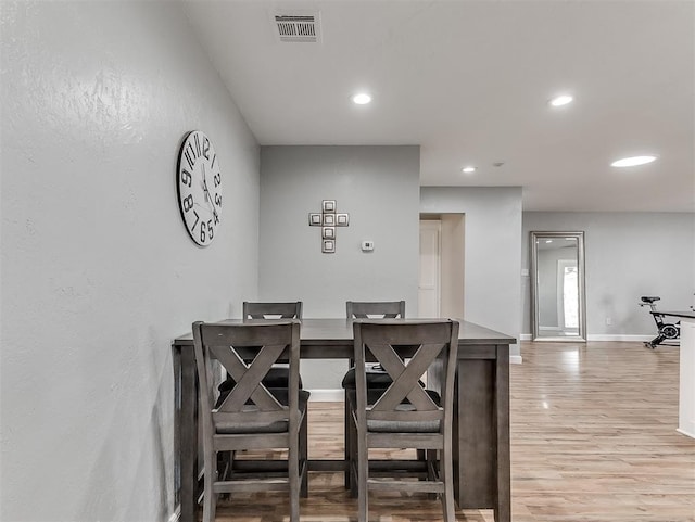 dining space featuring light wood-type flooring