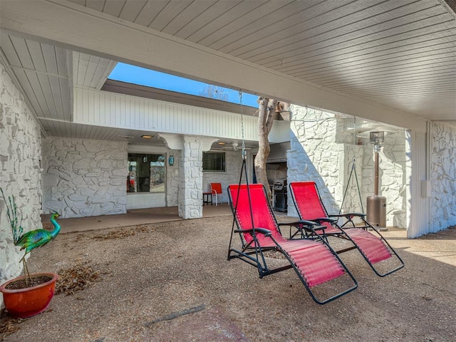 view of patio featuring a fireplace