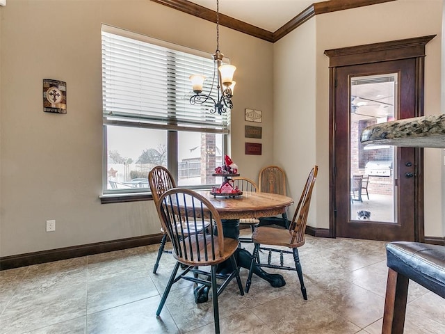 dining area with ornamental molding, a chandelier, and light tile patterned flooring