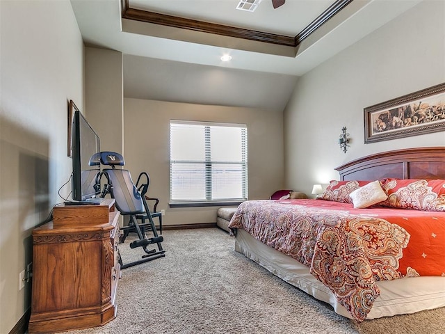 carpeted bedroom with lofted ceiling, crown molding, a raised ceiling, and ceiling fan