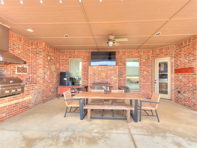 view of patio with exterior kitchen, ceiling fan, and grilling area