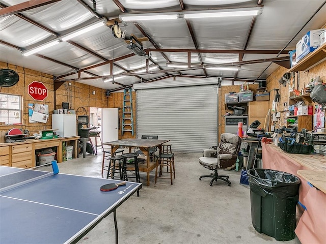 garage featuring a workshop area and metal wall