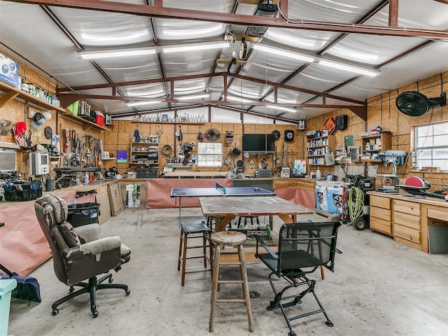 garage with metal wall and a workshop area