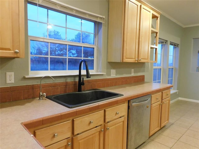 kitchen featuring light brown cabinetry, sink, dishwasher, and ornamental molding