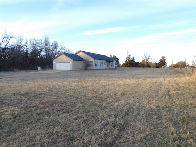 exterior space featuring a front yard and a garage