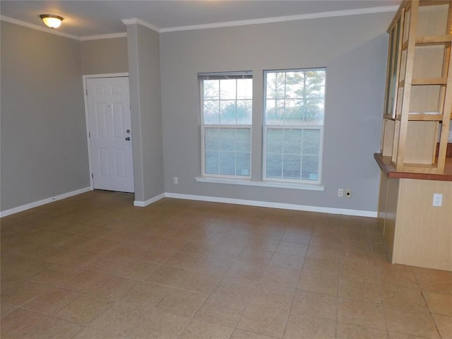 unfurnished room featuring ornamental molding