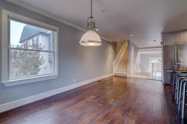 unfurnished living room with crown molding and dark wood-type flooring