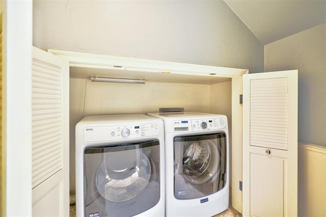 washroom with washer and dryer