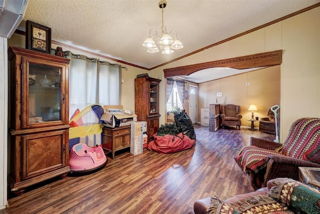 living room with lofted ceiling, crown molding, an inviting chandelier, a textured ceiling, and dark hardwood / wood-style flooring