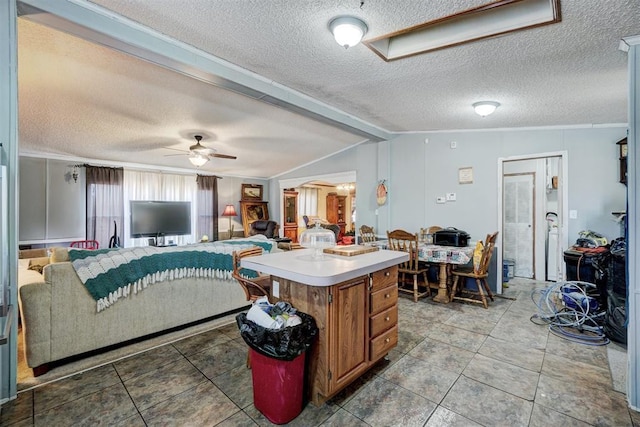 living room with lofted ceiling with beams, ceiling fan, and a textured ceiling