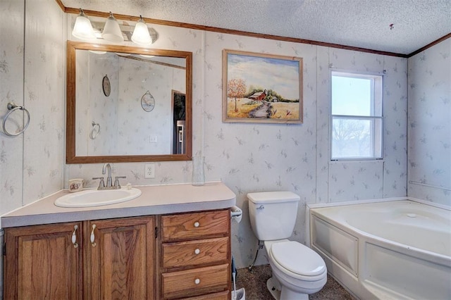 bathroom with toilet, a textured ceiling, ornamental molding, vanity, and a washtub