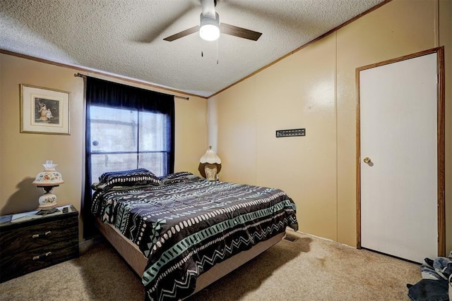 bedroom featuring crown molding, a textured ceiling, ceiling fan, and carpet flooring