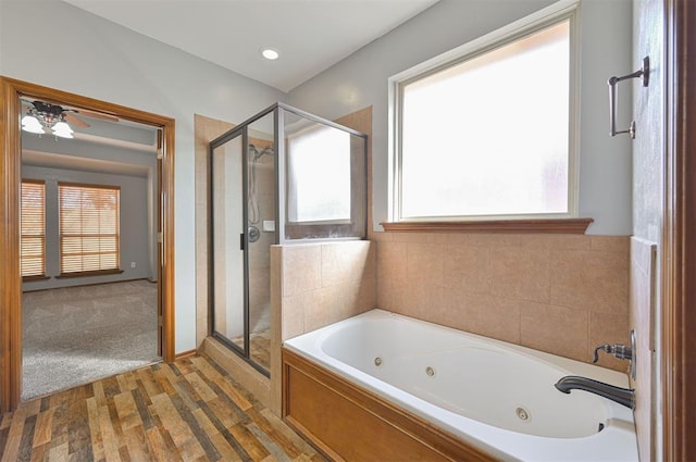 bathroom featuring hardwood / wood-style floors and independent shower and bath