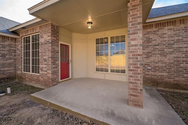 property entrance with a patio area