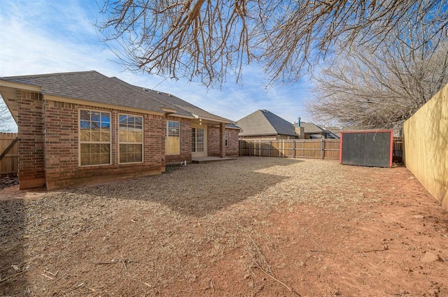 back of property with a shed