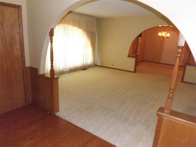 interior space with an inviting chandelier and carpet floors