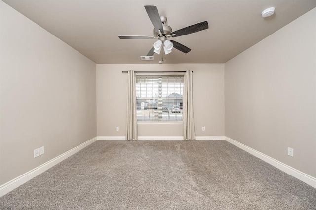 carpeted empty room with ceiling fan