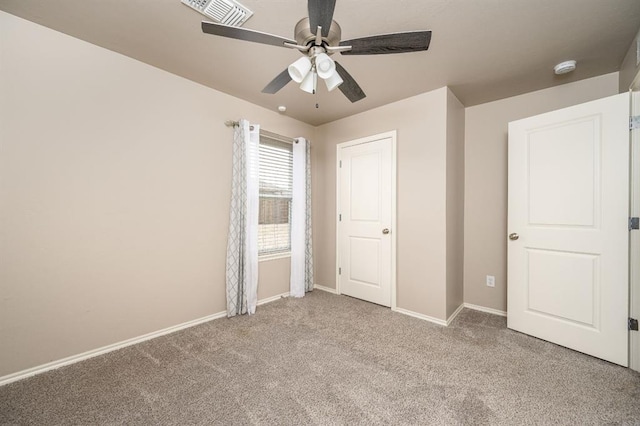 unfurnished bedroom with light colored carpet and ceiling fan