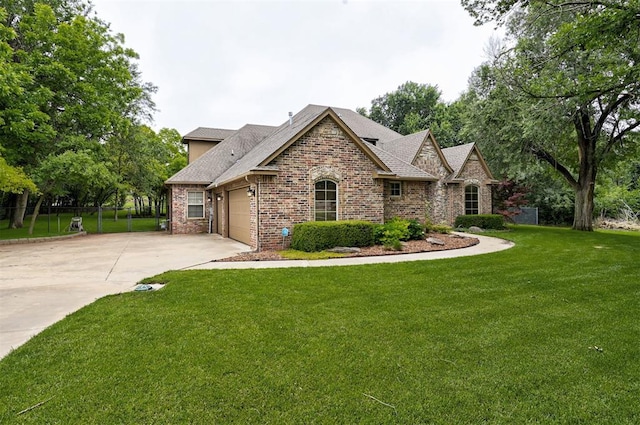 view of front of house with a front lawn and a garage