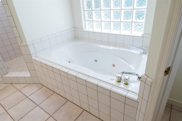 bathroom with separate shower and tub and tile patterned flooring