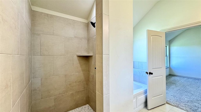 bathroom featuring independent shower and bath and lofted ceiling